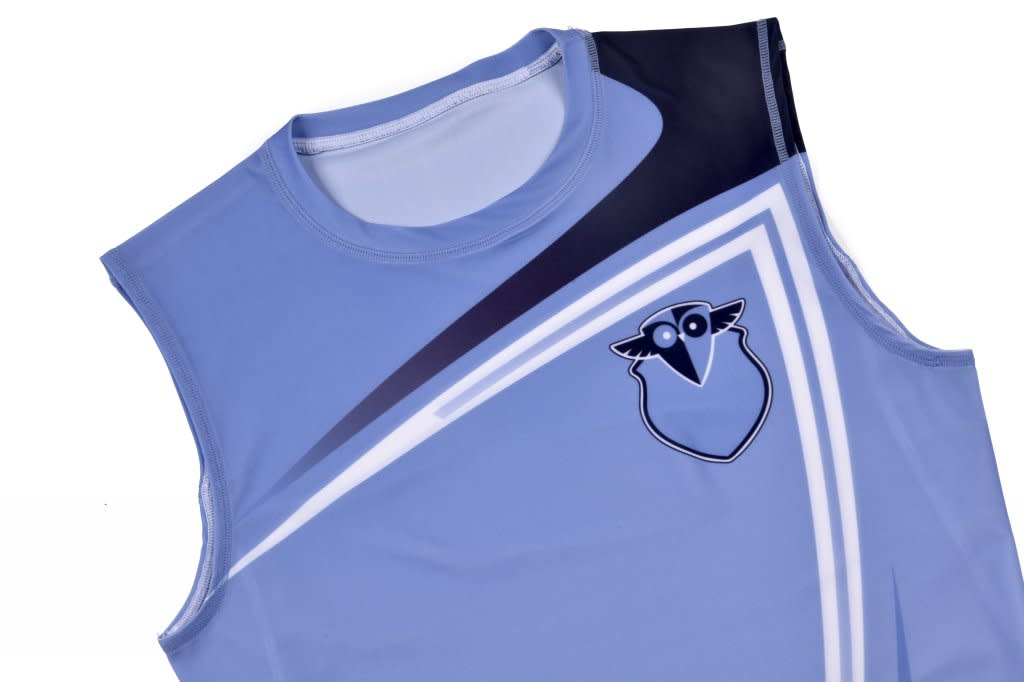 A light blue activewear vest featuring a graphic design in navy and a logo on the front.