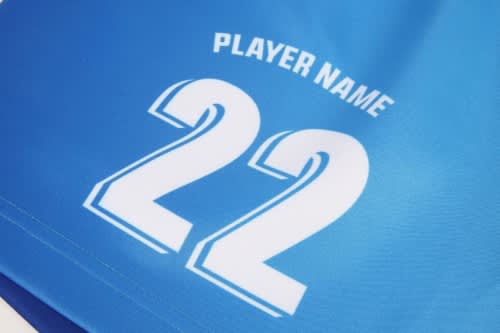 A blue sports jersey featuring the number 22 and a placeholder for the player's name, with a white logo.