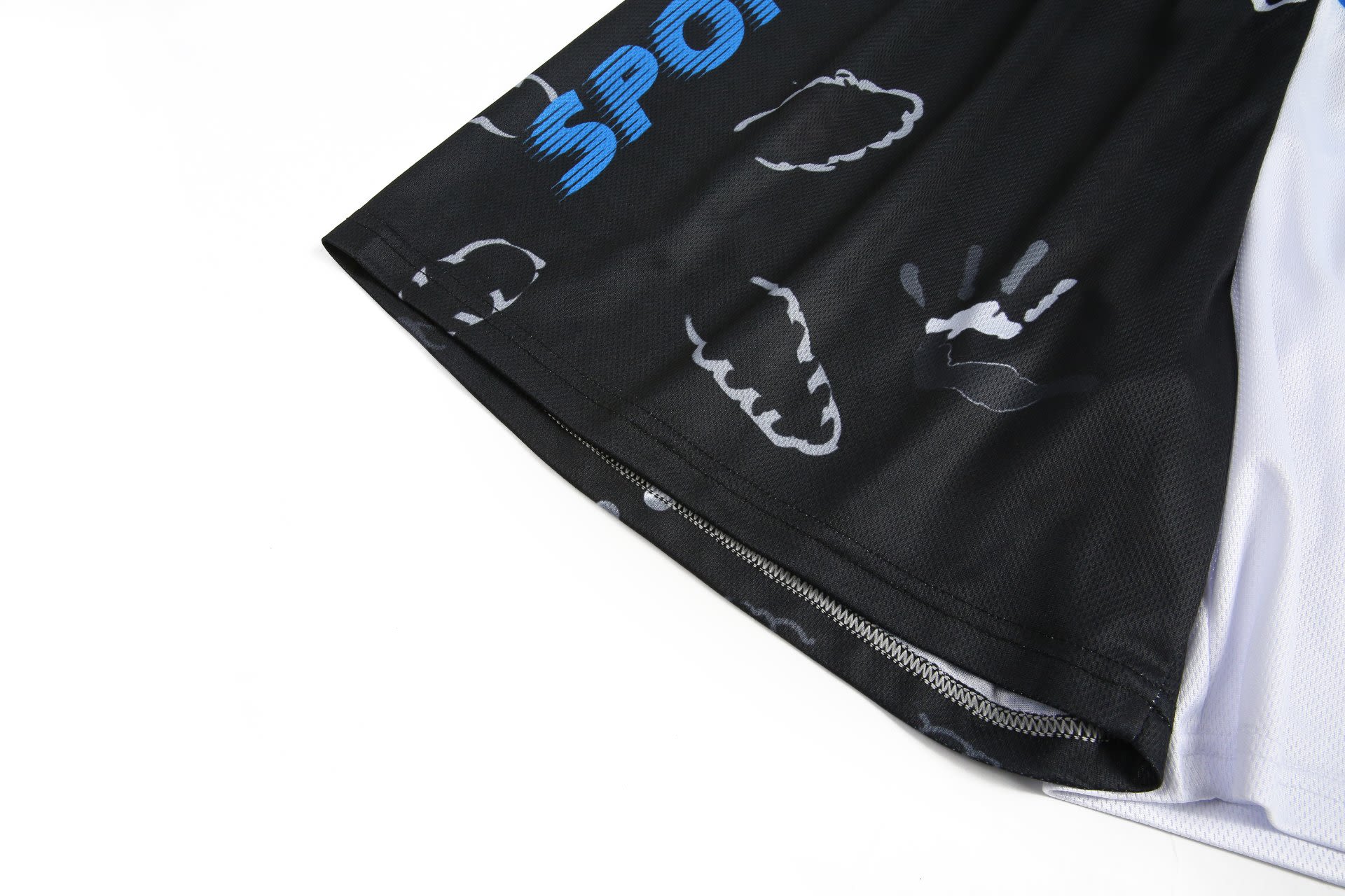 Shorts in black with a patterned design, featuring handprints and a logo on the side.