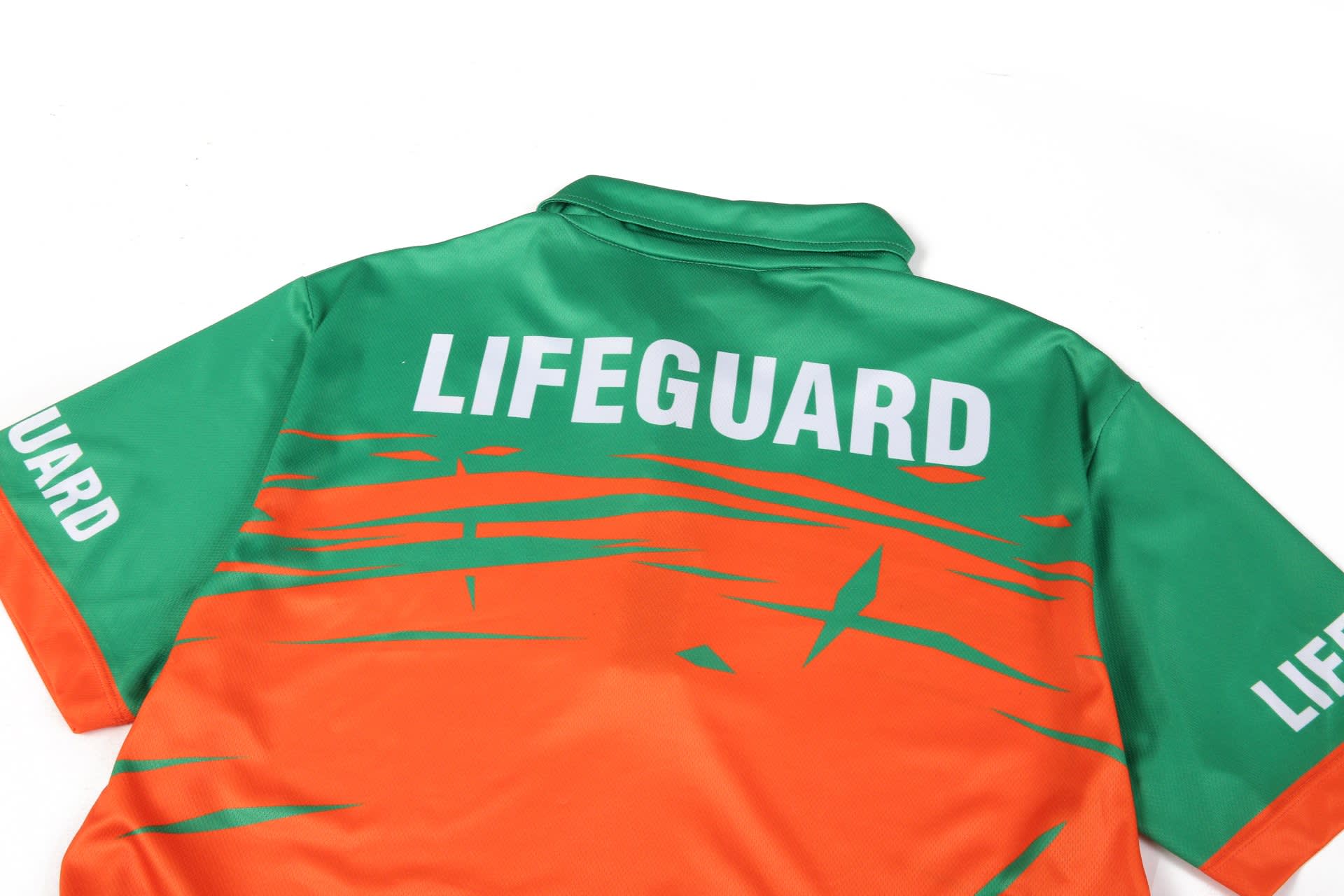 A green and orange polo shirt with a back design featuring the word "LIFEGUARD" and a logo.