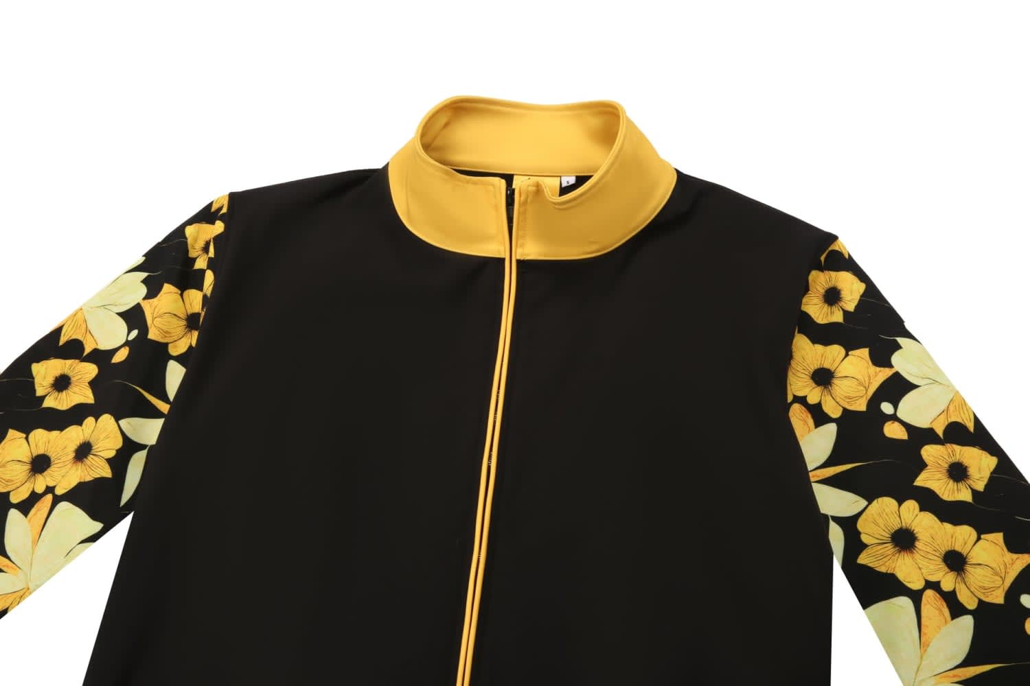 A softshell jacket in black with yellow accents and floral patterned sleeves. It features a zip closure and a collar.