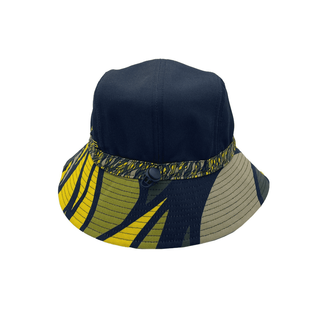 A navy and patterned bucket hat featuring yellow and green designs, with a branded logo.
