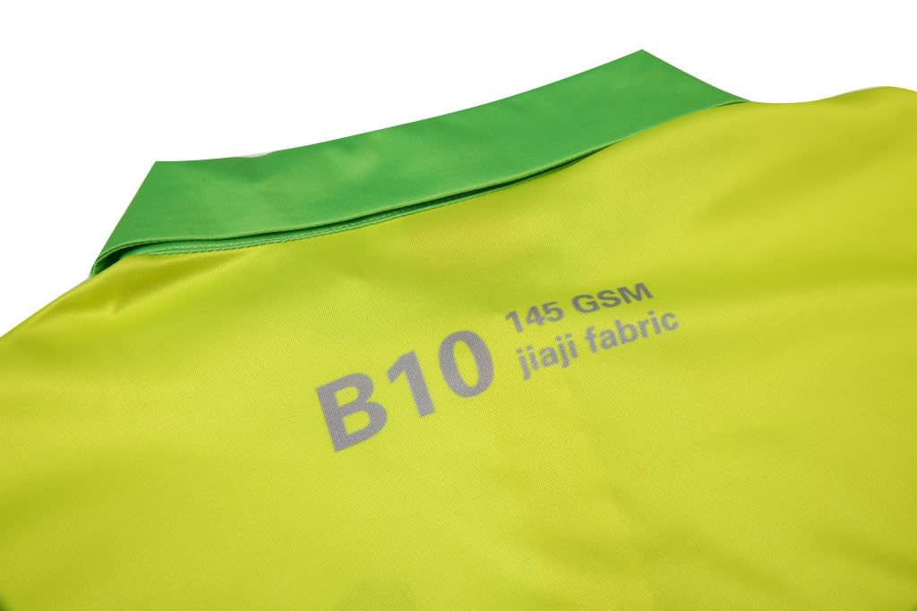 A safety zip polo featuring a vibrant yellow body and green collar, made from 145 GSM jiaji fabric.