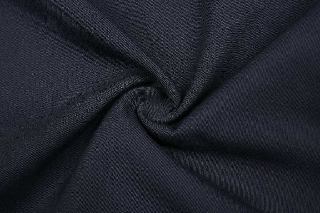 A swirl of dark navy fabric, showcasing the texture and weave of the material.