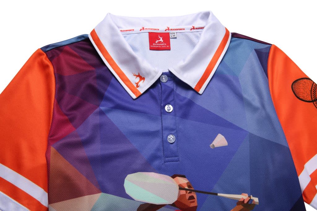 A multi-coloured badminton club uniform featuring a graphic design, with a white collar and an attached logo.