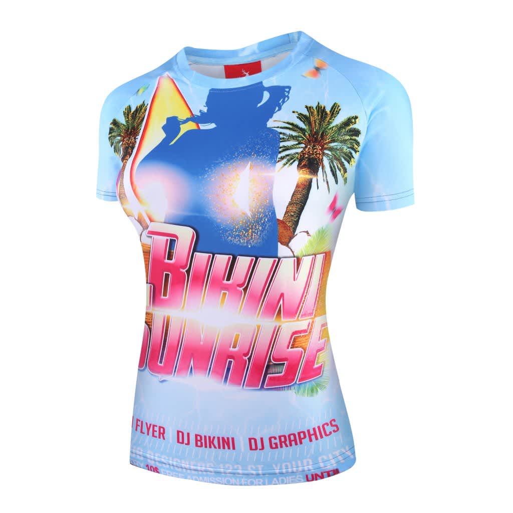 A women's tee shirt in light blue featuring a colourful graphic design with palm trees and vibrant elements.