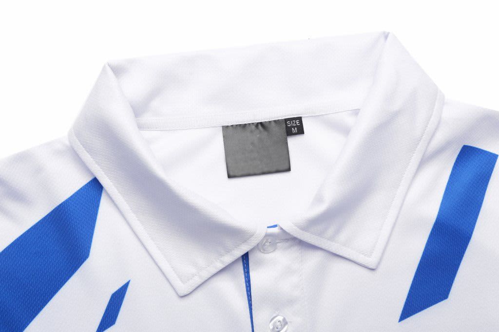 A white polo shirt with blue accents and a collar, featuring a size tag labelled 'M'.