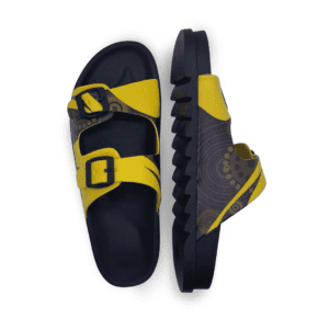 A pair of yellow and black sandals featuring a patterned design and a buckle strap. The sandals have a textured sole.