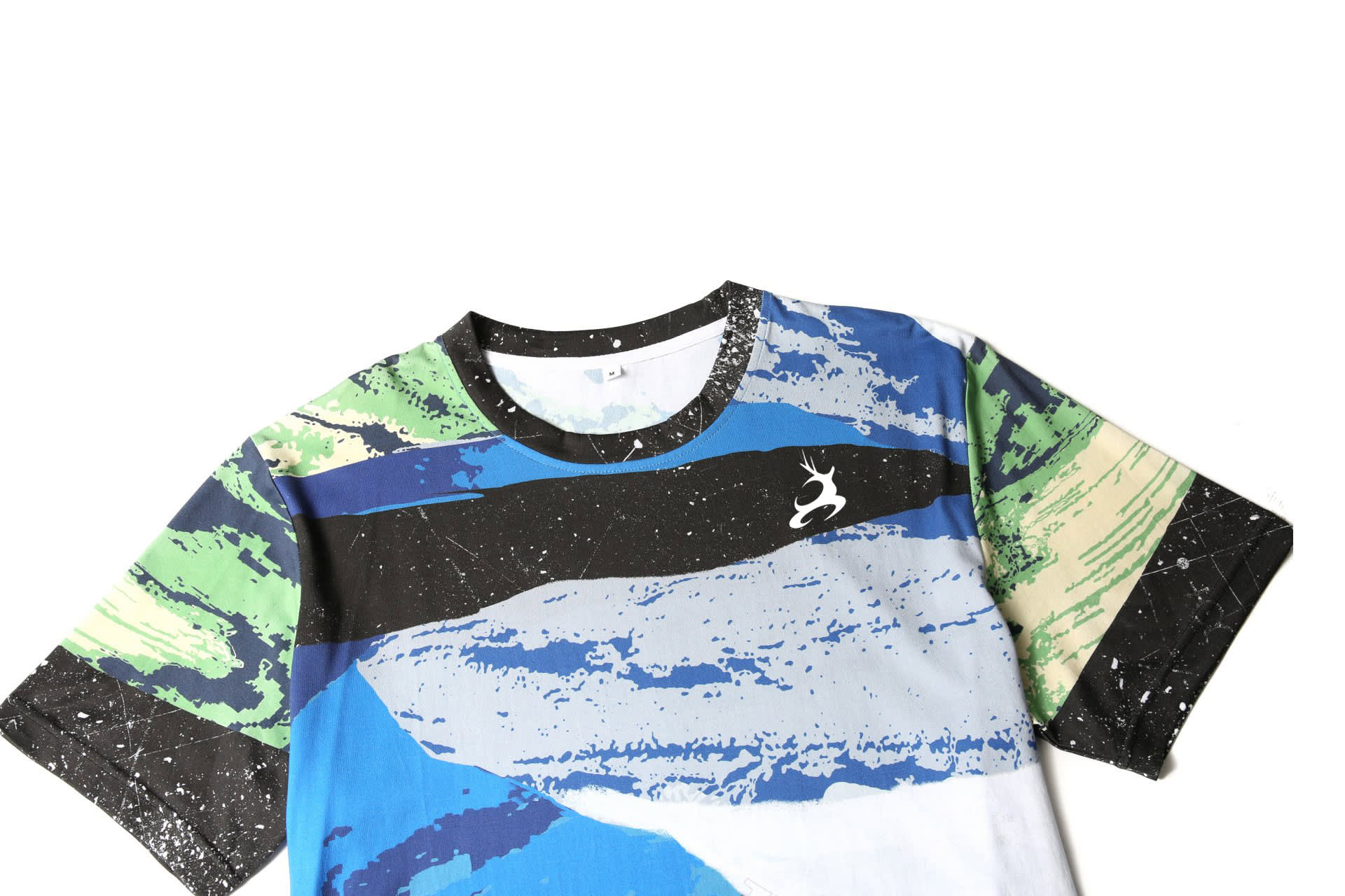 A custom made printing cotton tee in blue, green, black, and white with a logo on the chest area.