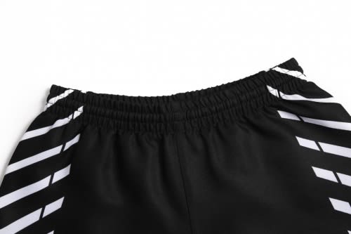 A black sports uniform with white stripes, featuring an elastic waistband. The image focuses on the top portion of the shorts.