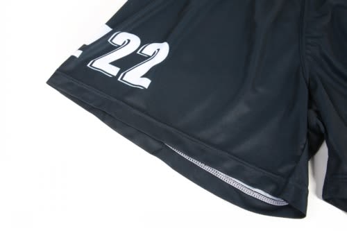 A black volleyball uniform featuring white numbers and a logo, designed for sports activities.