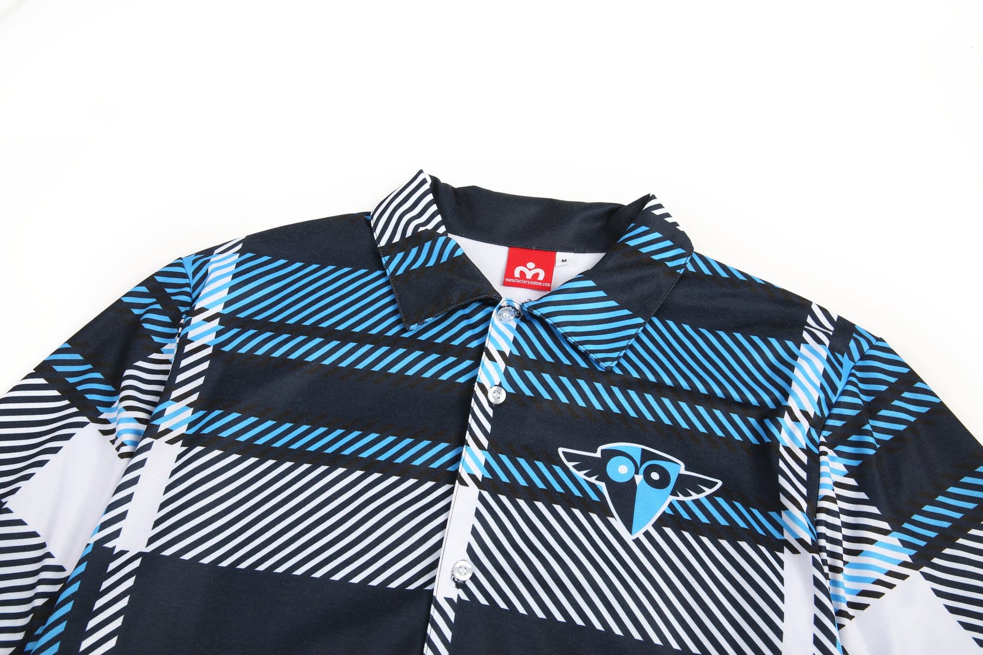 A flannel shirt in a black, blue, and white geometric pattern, featuring a logo on the chest.
