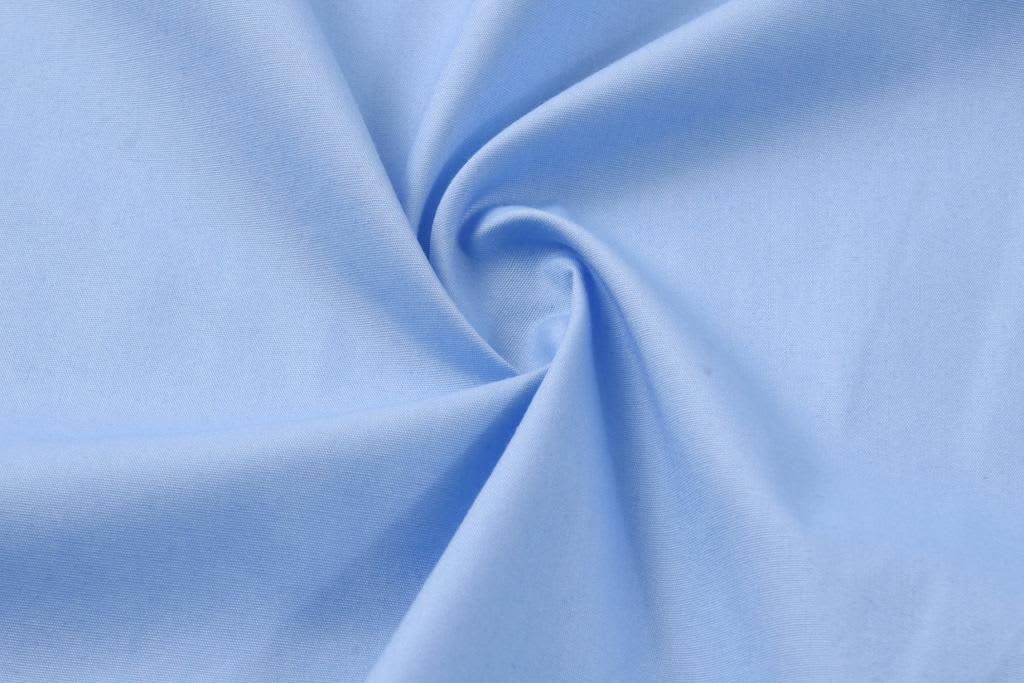 A light blue fabric with a smooth texture, showcasing a twirling design. It has a soft, comfortable appearance.
