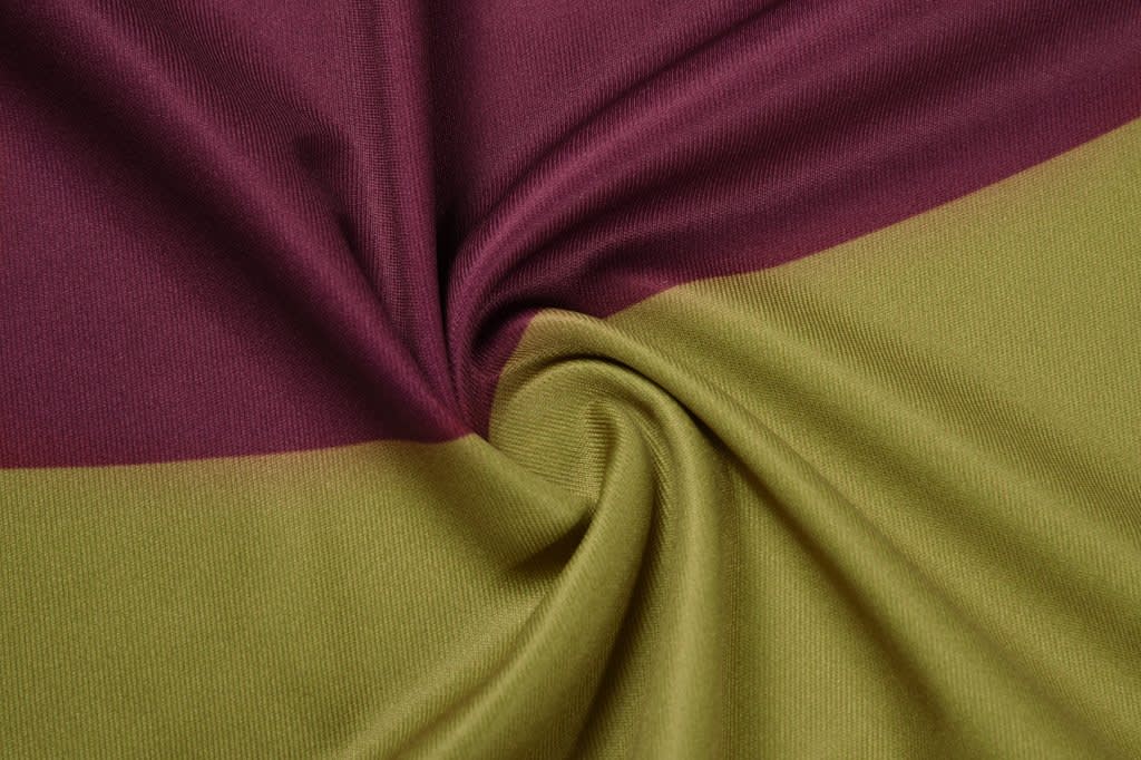 A fabric swatch featuring maroon and olive green stripes, with a soft, textured appearance.