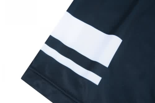 A black volleyball uniform featuring two horizontal white stripes on the sleeve. The fabric appears smooth.