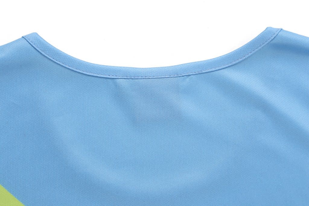 A blue shirt featuring a rounded neckline and a vibrant design, with a prominent logo at the back.
