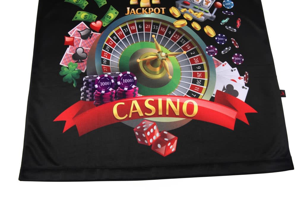 A black promotional product featuring a casino theme with roulette, cards, chips, and dice. It has a logo.