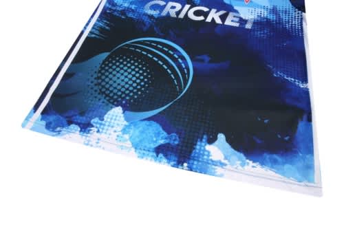 A blue cricket jersey featuring a graphic design and a logo. The fabric appears lightweight and breathable.