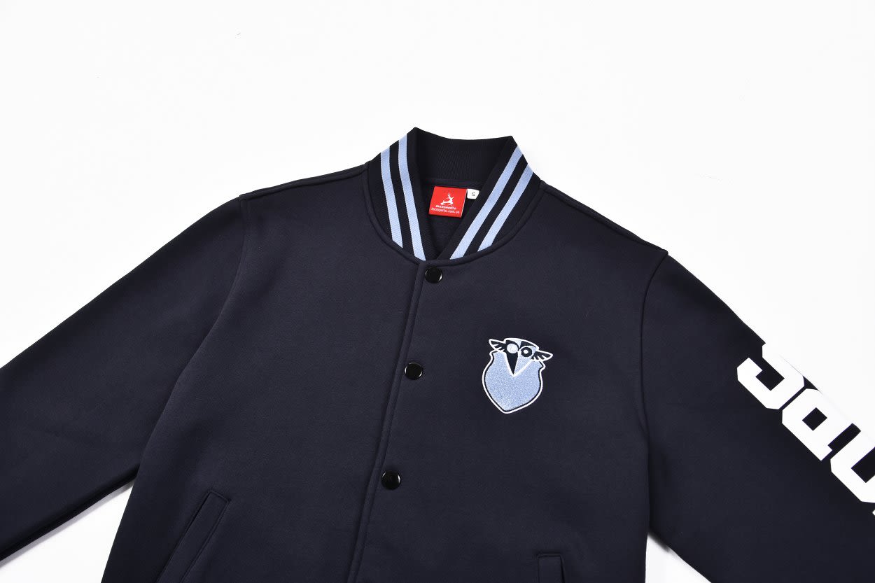 A navy baseball jacket featuring a blue and white logo, with contrasting stripes on the collar and a branded sleeve.
