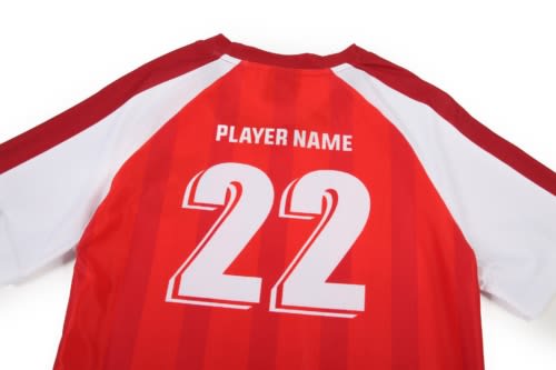 A red and white soccer jersey featuring a number 22 on the back and a logo on the chest.