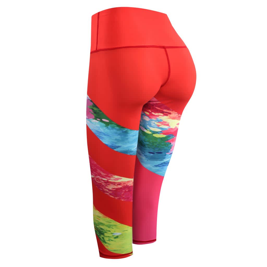 TIGHT 3/4 PANTS-LADY in red with colourful painted designs on the sides. Features a logo on the waistband.