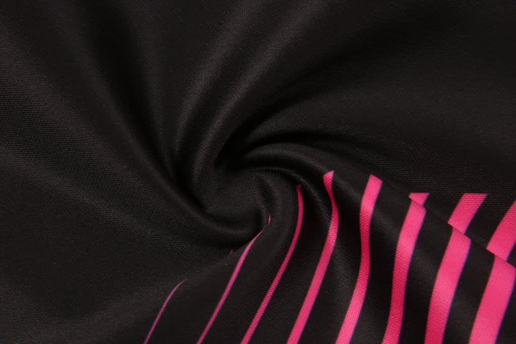 A black fabric with pink stripes, showcasing a smooth, swirling texture. The material appears soft and flexible.