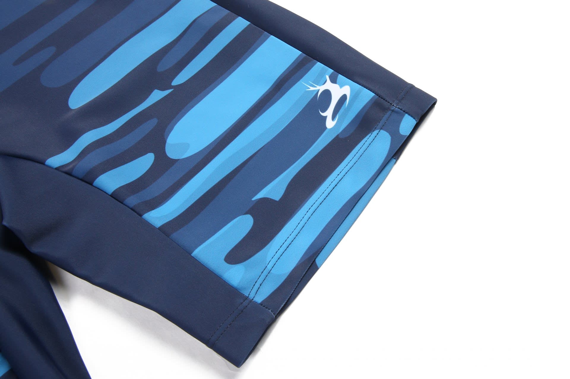 TIGHT SHORTS featuring a blue and navy patterned design, with a logo on the side.