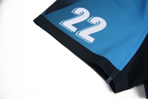 A sports jersey featuring a blue and black design with the number 22 prominently displayed. It has a logo on it.