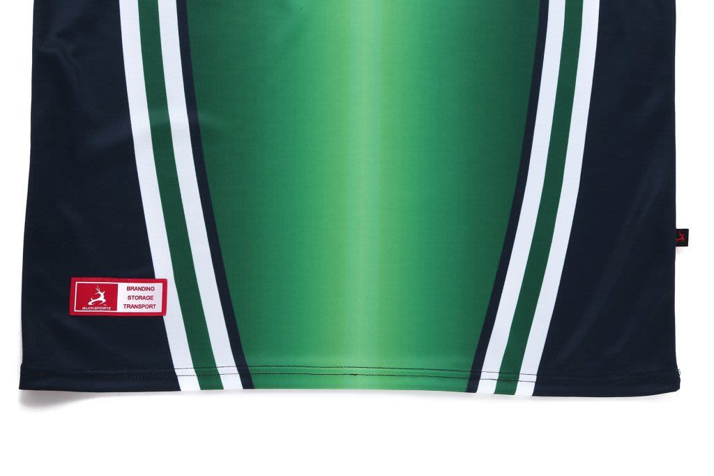 A polo shirt in green gradient with navy blue and white stripes, featuring a logo and branding label.