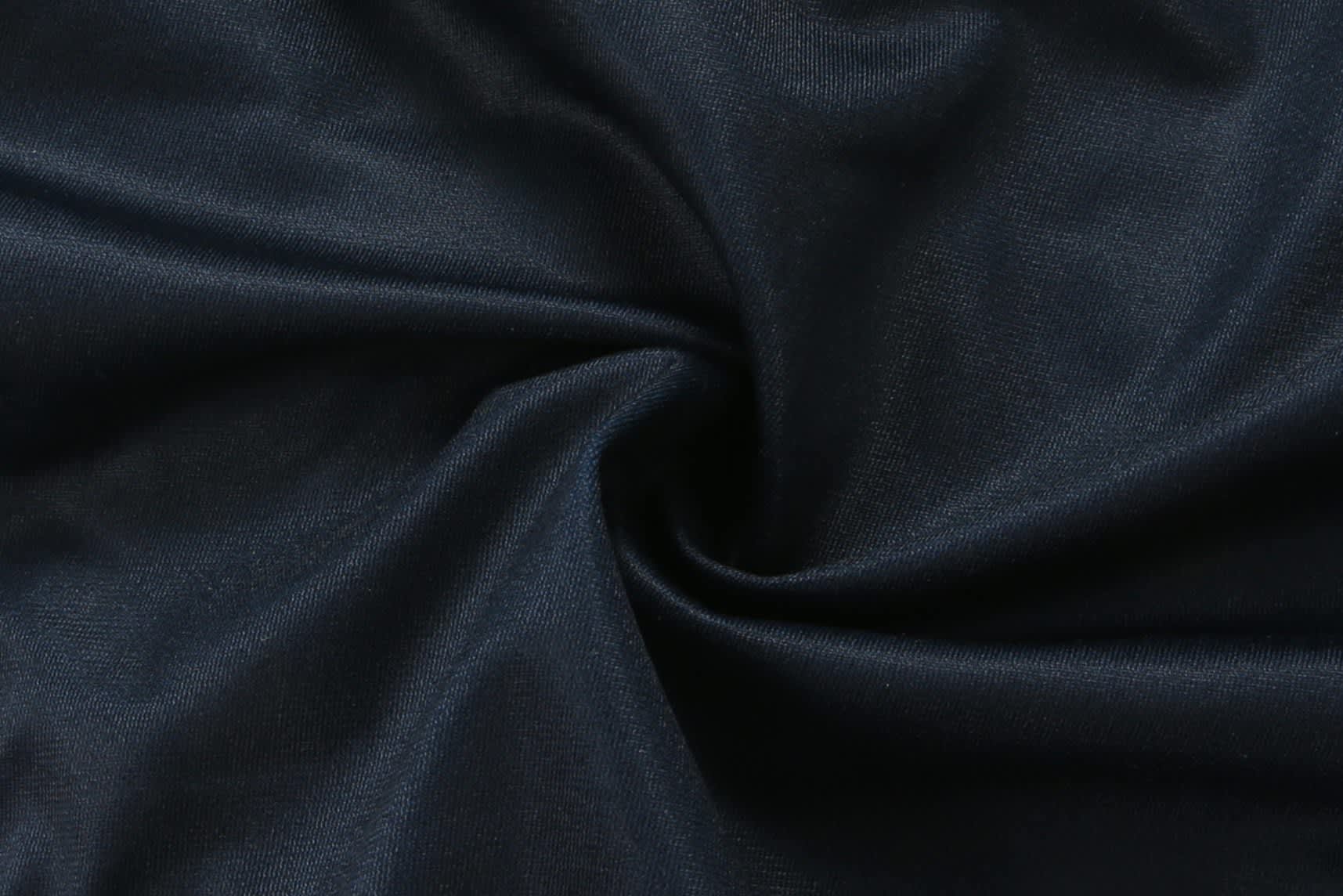A dark navy fabric with a smooth texture, featuring a swirl pattern.