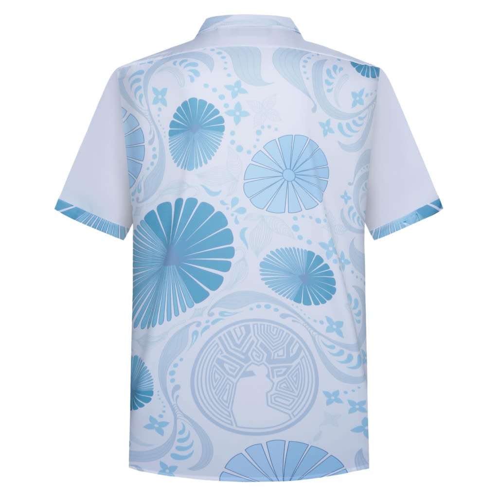 A short-sleeved shirt in light blue with a floral pattern and a logo on the back.