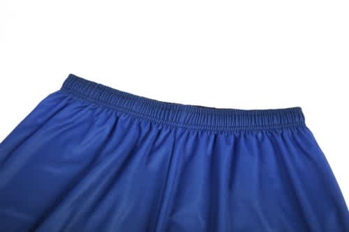 A pair of blue basketball shorts featuring an elastic waistband and a smooth texture.