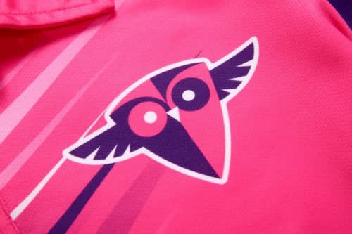 A pink sports uniform featuring a stylised owl logo with wings, designed for squash.