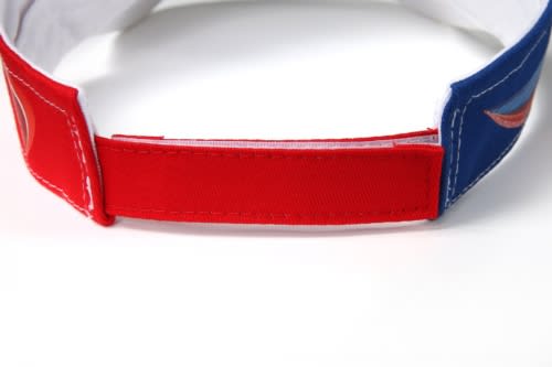 A multicoloured sublimation visor featuring red and blue fabric sections and an adjustable strap at the back.