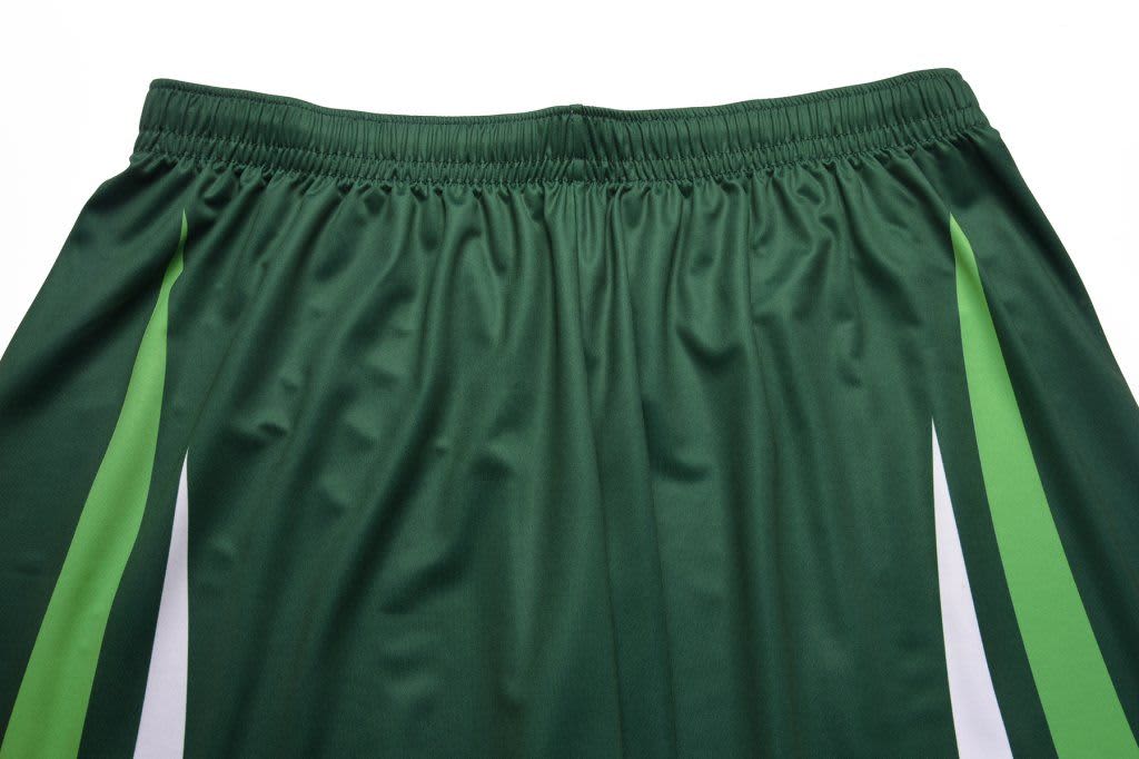 A pair of green sports shorts with white and green stripes along the sides. The waistband is elasticated.