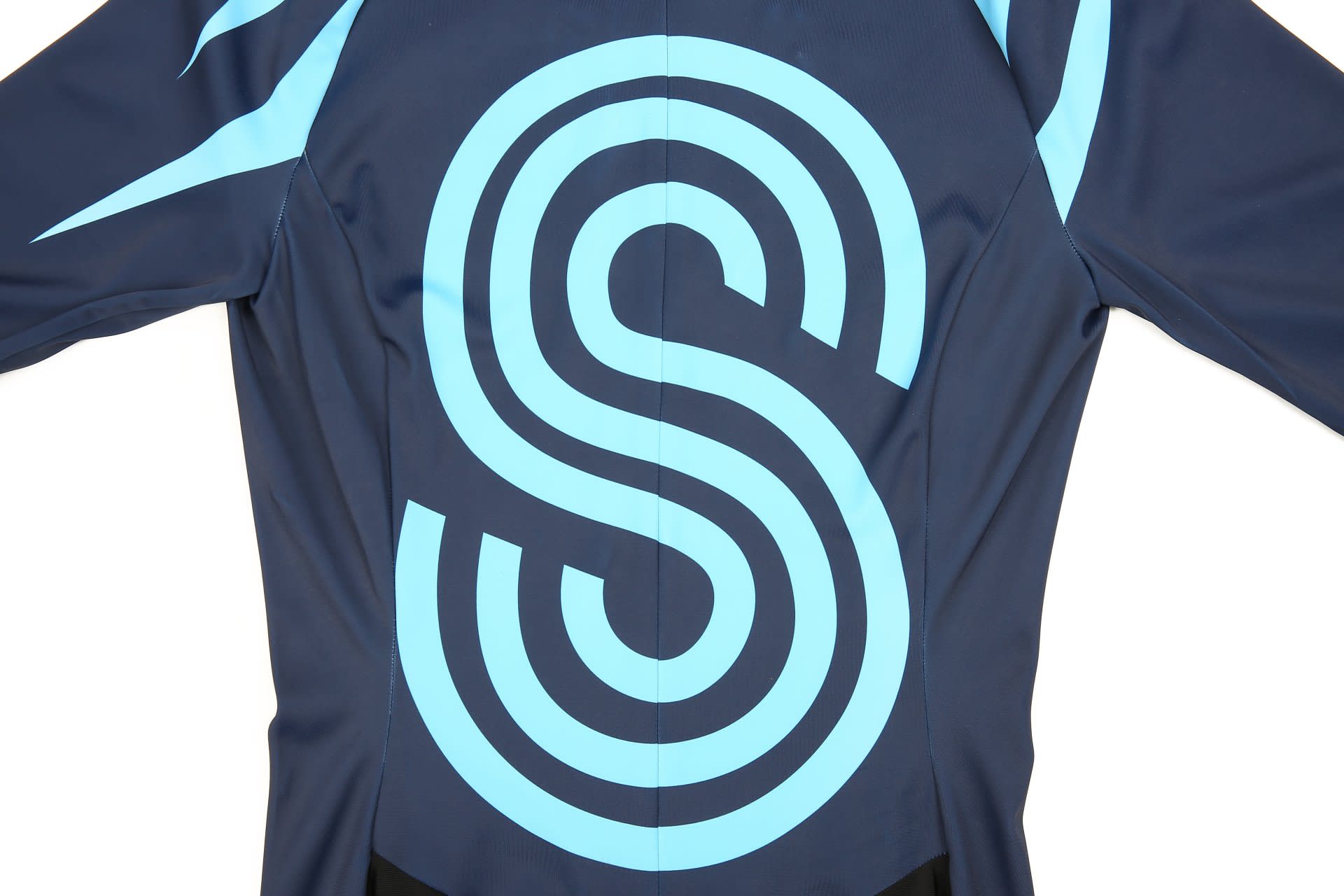 An inline speed skating suit featuring a blue design with a prominent logo, set against a navy background.