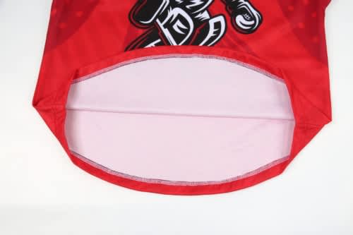 A red hockey jersey featuring a graphic design and a visible interior lining, with a logo present.