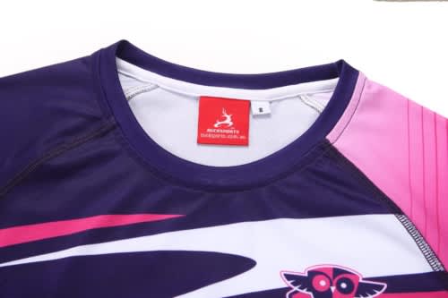 A purple and pink swimming coat with a logo, featuring a high collar and short sleeves.