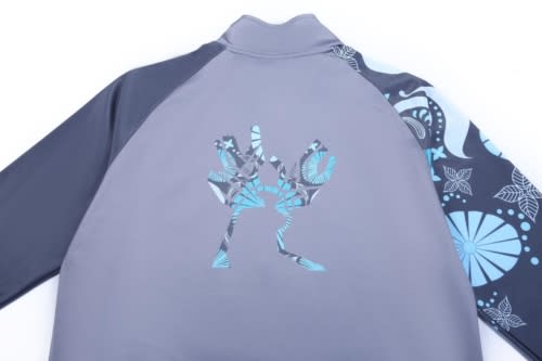 A grey jacket with patterned blue sleeves and a logo on the back, designed for sports uniforms.