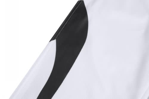 A white sports jersey featuring black design details and a logo on the fabric.