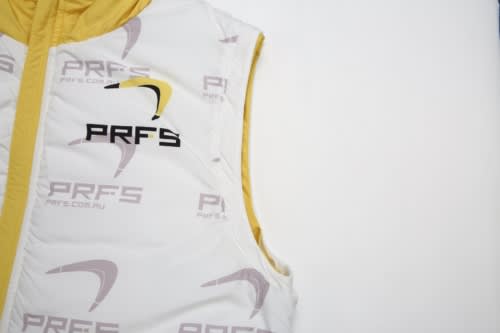A white and yellow puffer vest with a removable hood and branding, featuring a sleeveless design.