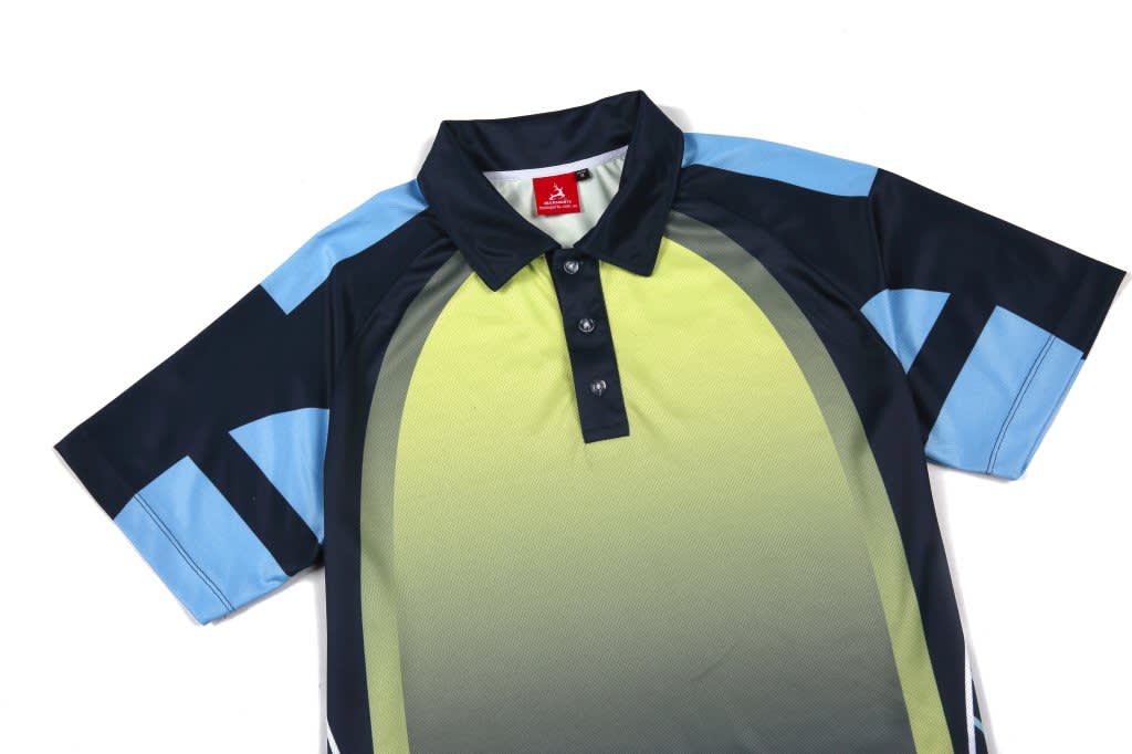 A short-sleeved polo shirt in shades of green, navy, and blue, featuring a button-up collar and a branded label.