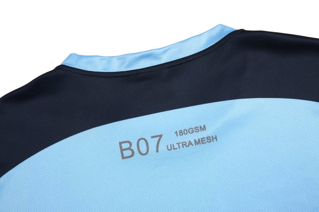 A navy and sky blue softball team wear T-shirt featuring a logo on the back. Made from ultra mesh fabric.