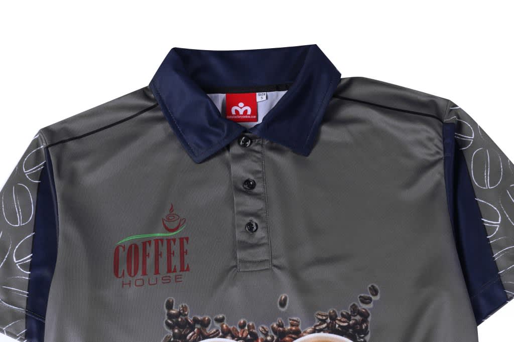 A camouflage polo shirt in grey and navy, featuring a collar and buttons, with a logo on the front.
