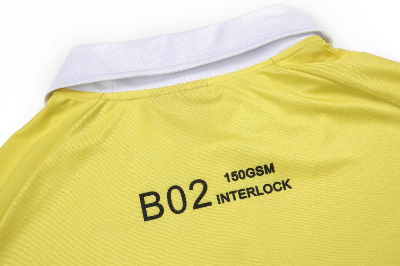 A yellow polo shirt featuring a white collar and a logo on the back, made from interlock fabric.