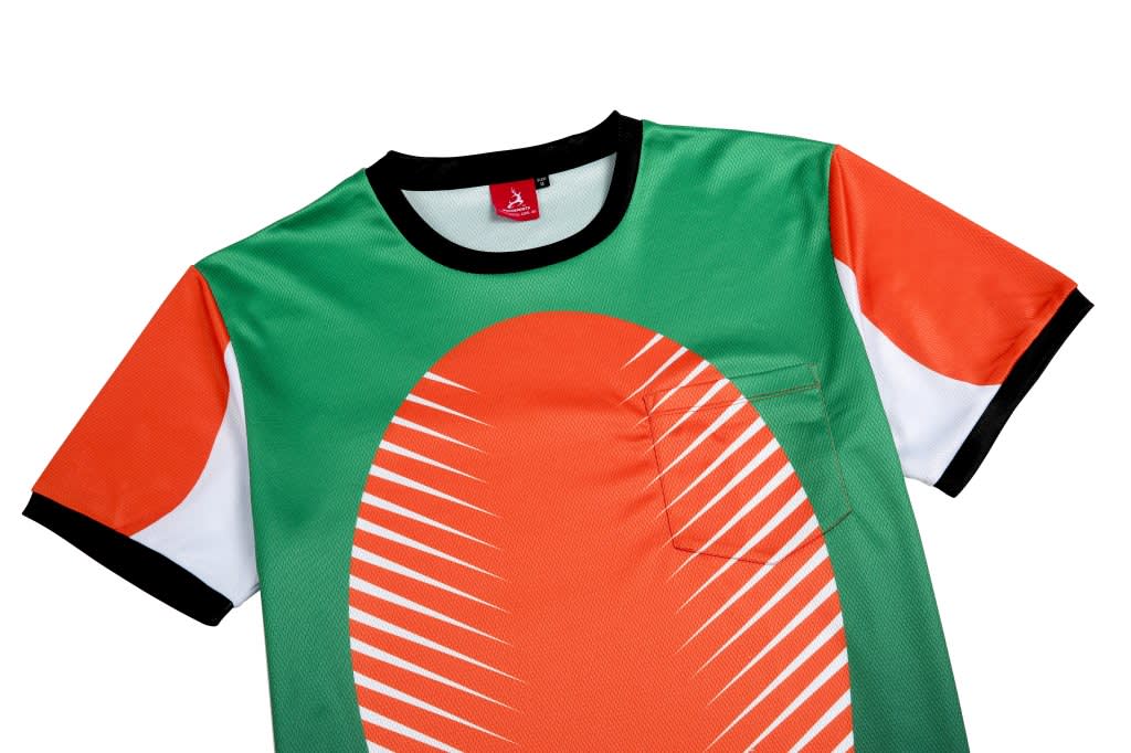 A green and orange custom esports t-shirt featuring a unique design and a pocket. It has black accents around the neckline.