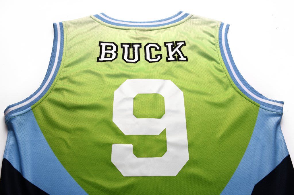 A green and blue basketball singlet featuring the number 9 and a name on the back, with a logo present.