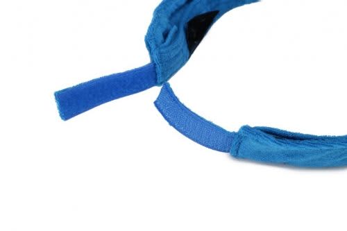 A blue soft peak visor with adjustable straps, featuring a simple design and a soft texture.