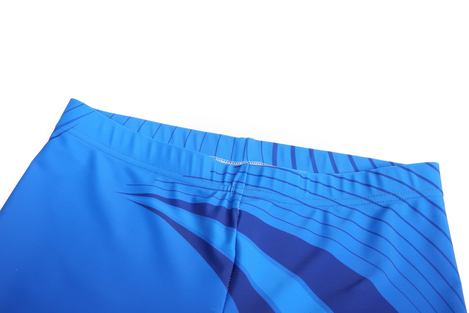 Bright blue shorts featuring a sleek design and an elastic waistband, with a subtle logo visible.