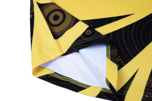 A sports vest featuring a vibrant yellow design with black patterns and a logo.